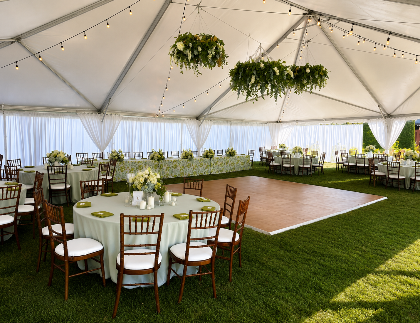 Real tent and patio party setup with string lights by Friendly Party Rental